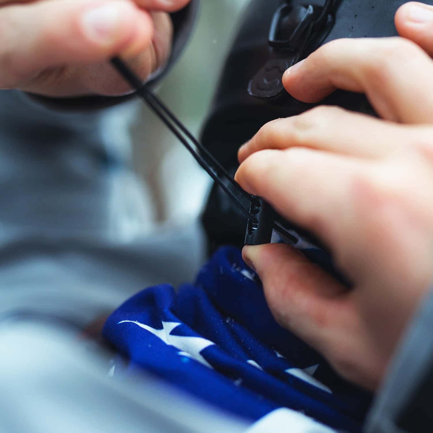 Man Modeling A Heavyweight Custom Neck Gaiter and Demonstrating Drawstring Use